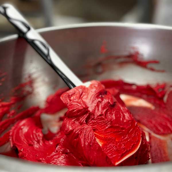 Red Frosting getting ready to go on a custom cake at Brewster Pastry